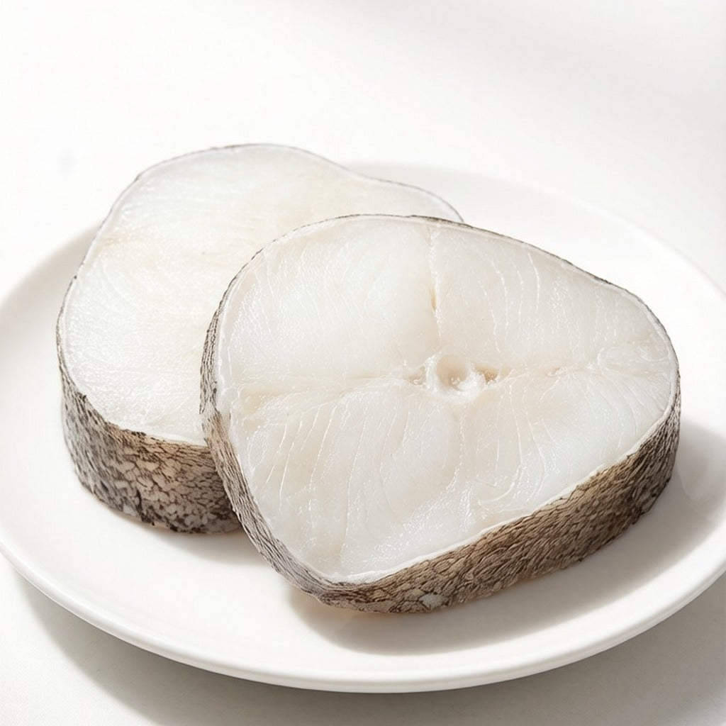 Steamed cod loin topped with ginger, scallion and soy